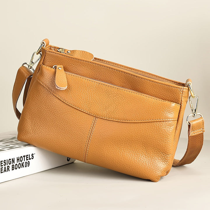 Rina – Bolso bandolera elegante con diseño de guijarros