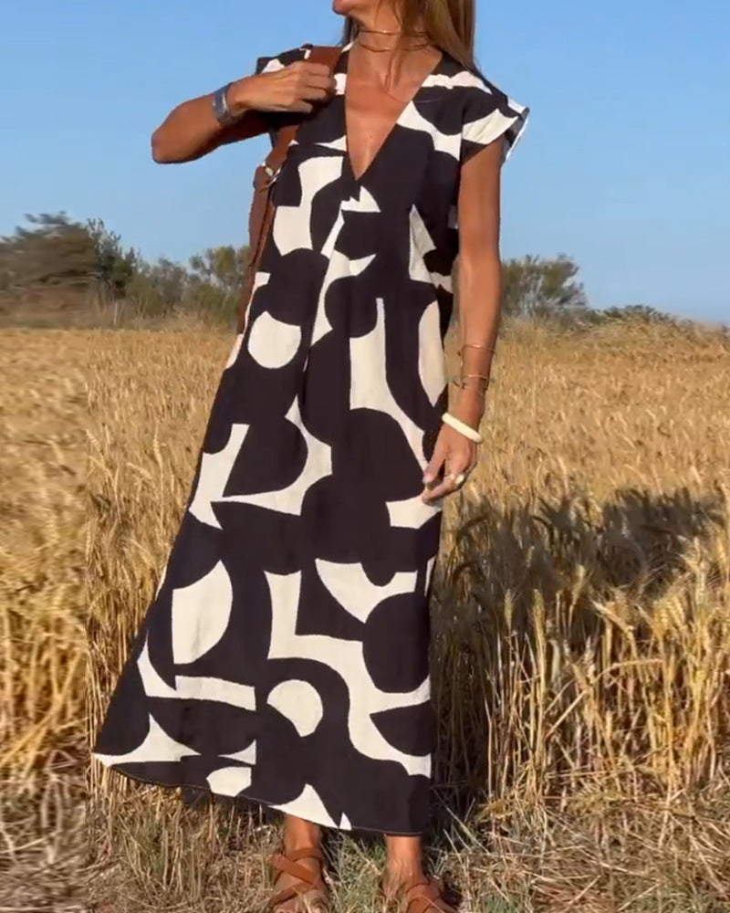 Paula – Vestido elegante con estampado y cuello en V