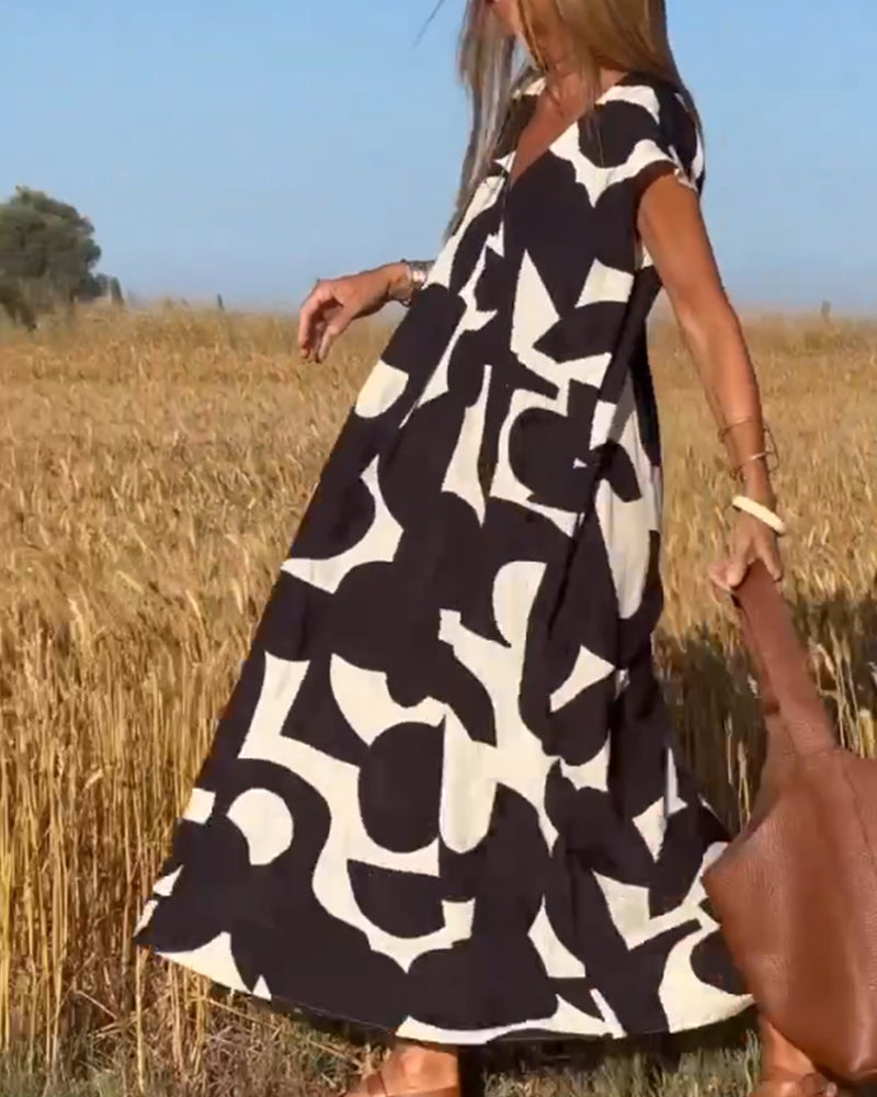 Paula – Vestido elegante con estampado y cuello en V