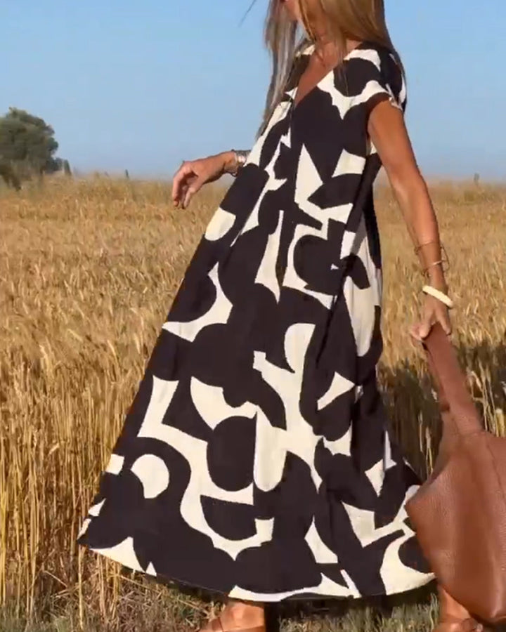 Paula – Vestido elegante con estampado y cuello en V