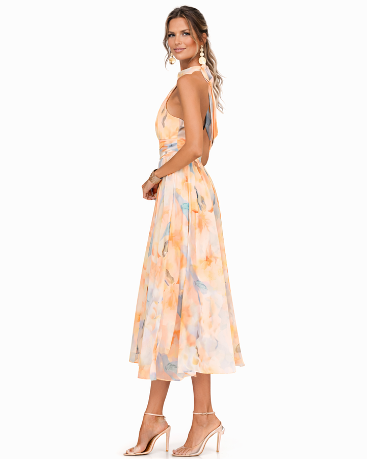 Dolores – Vestido largo fluido con cuello halter y estampado elegante