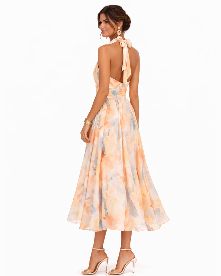 Dolores – Vestido largo fluido con cuello halter y estampado elegante