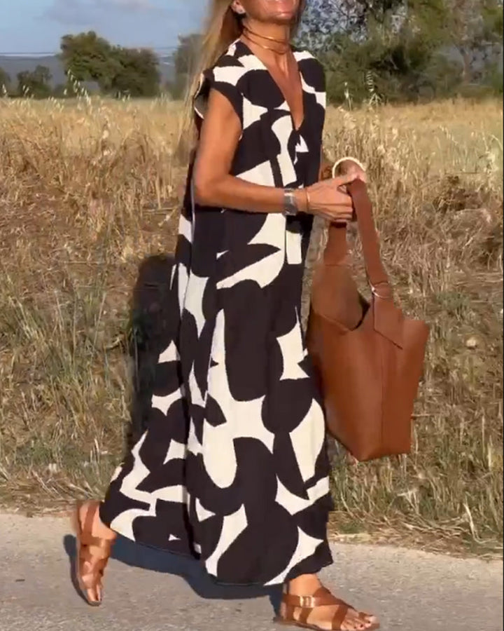 Paula – Vestido elegante con estampado y cuello en V