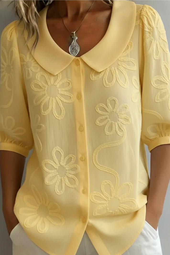 Flora – Blusa cuello redondo con motivo floral