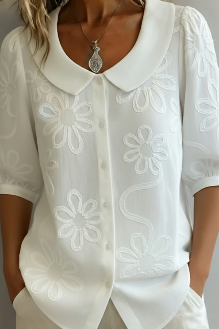 Flora – Blusa cuello redondo con motivo floral