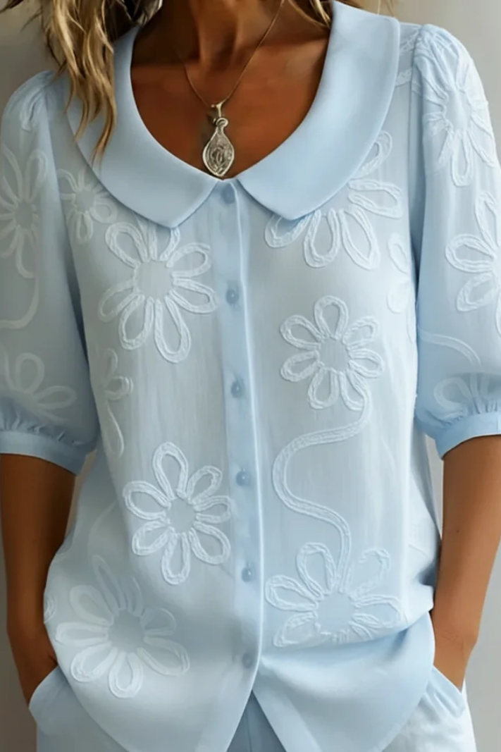 Flora – Blusa cuello redondo con motivo floral
