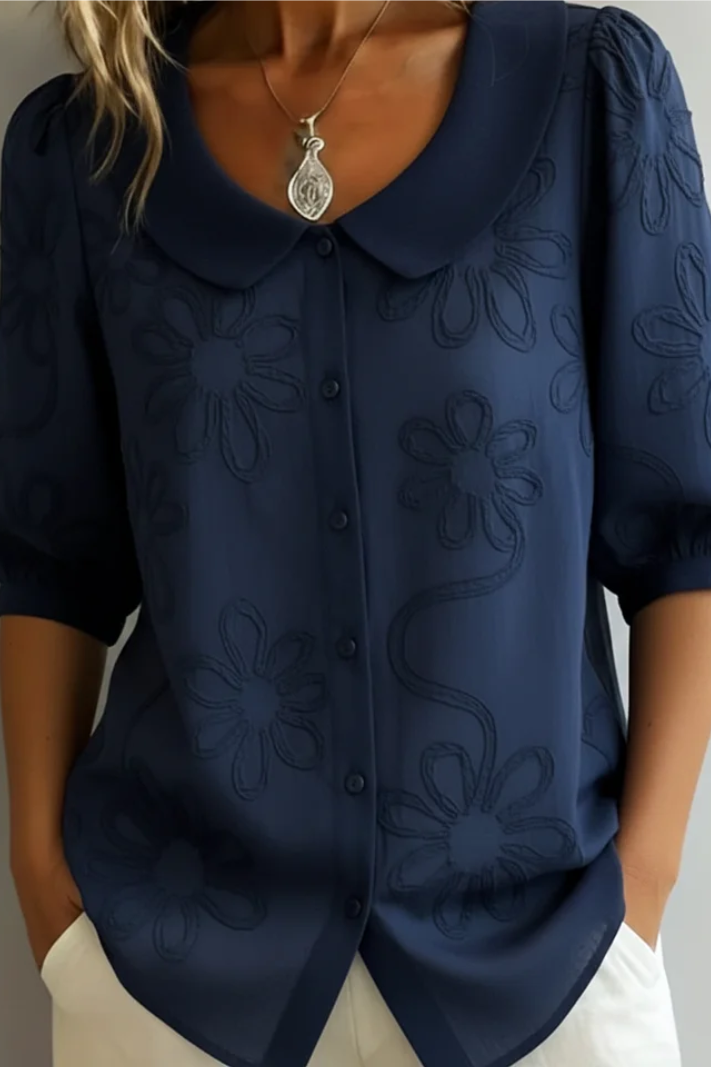 Flora – Blusa cuello redondo con motivo floral