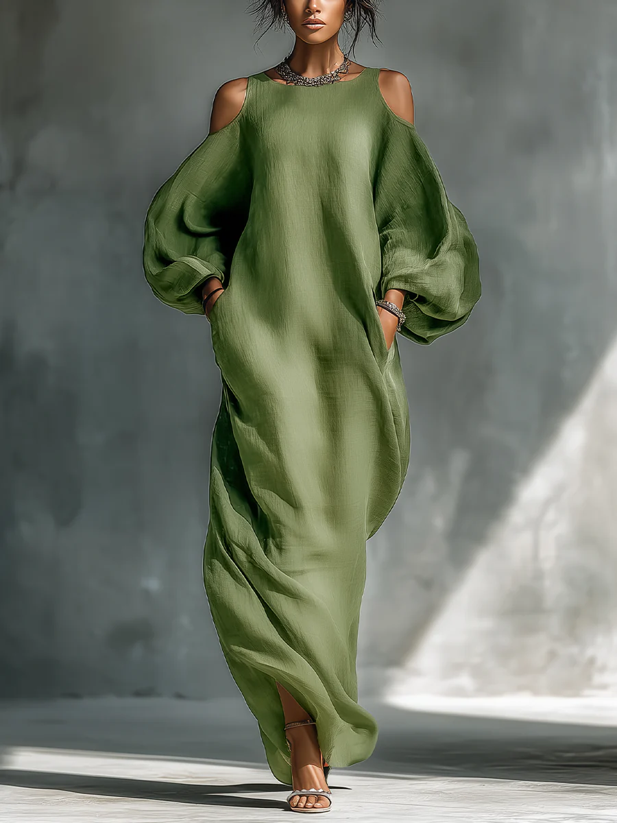 Selena – Vestido largo verde fluido con hombros descubiertos y mangas elegantes