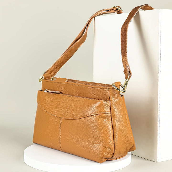 Rina – Bolso bandolera elegante con diseño de guijarros