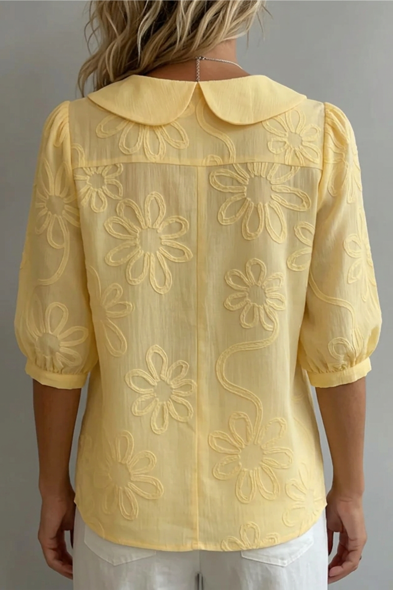 Flora – Blusa cuello redondo con motivo floral