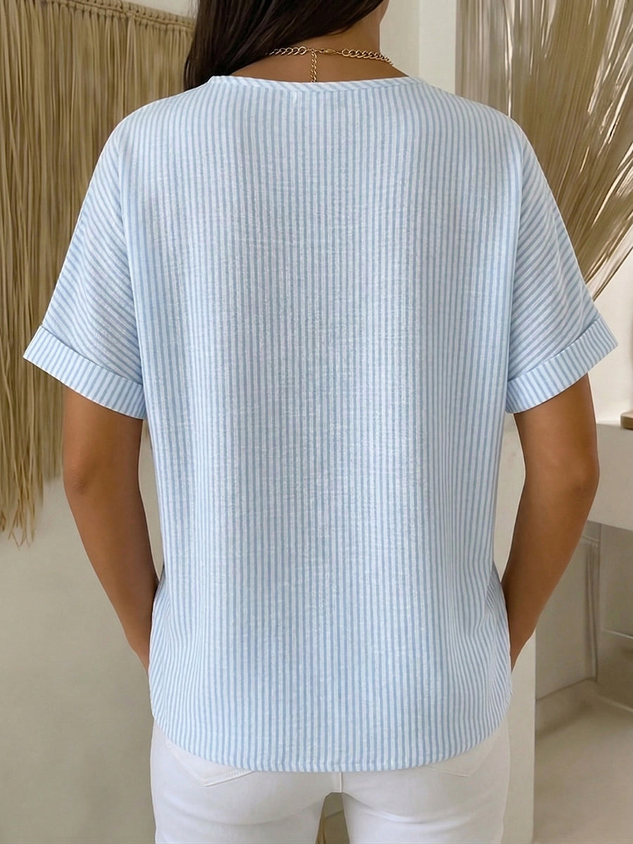 Lucía – Blusa a rayas con corte elegante