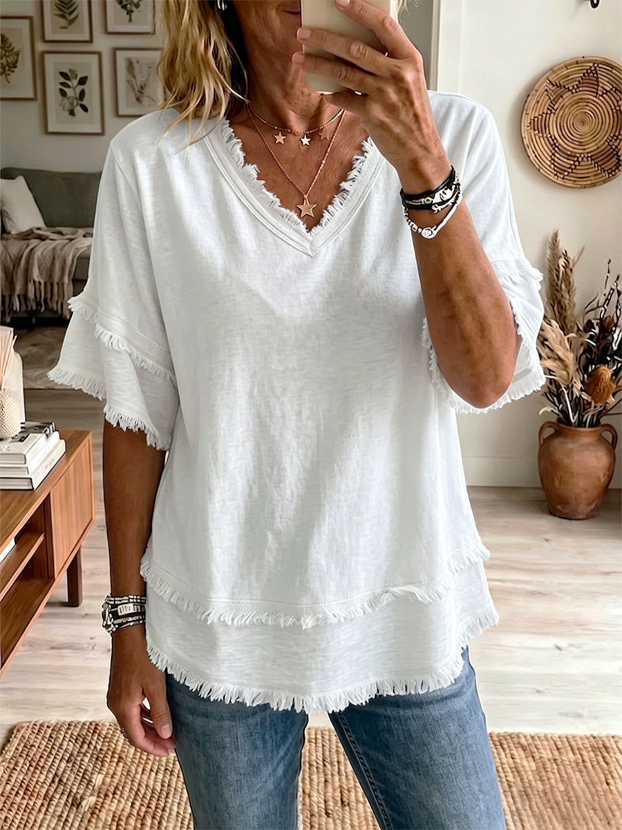 Isabella – Top elegante con mangas cortas y dobladillo sin acabado